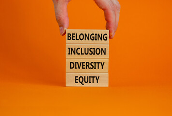 Equity, diversity, inclusion and belonging symbol. Wooden blocks with words equity, diversity,...