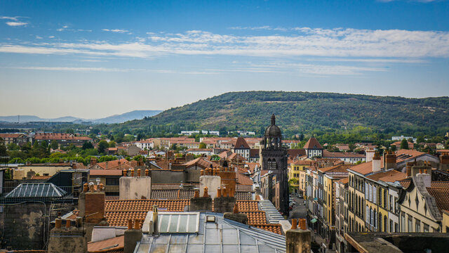 View from the top of the belfry on the Clock tower street, the Notre-dame du Marthuret and the roofs of the small town of Riom in Auvergne (France)