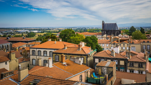 View from the top of the belfry on the Sainte Chapelle (Holy Chapel) and the roofs of the small town of Riom in Auvergne (France) 