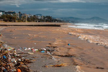 Waves pushing plastic waste to the beach