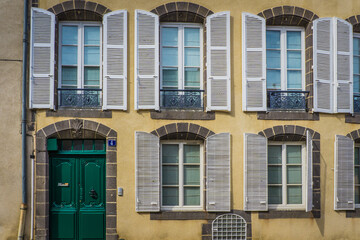 Fototapeta na wymiar Typical facade of a french townhouse in the small city of Riom (Auvergne, France).
