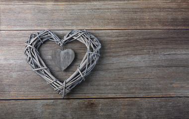 Braided heart on a wooden background, concept theme Love and St. Valentine's Day