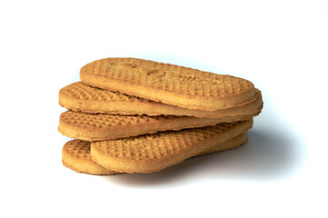 Stack of textured brown cookies isolated on white background