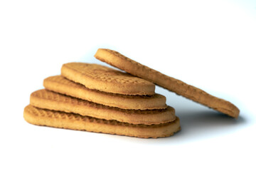 Stack of textured brown cookies isolated on white background