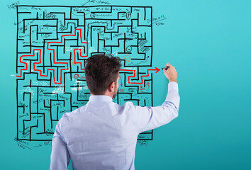 Businessman solve a complex maze with a lot of difficulties