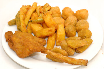 Mixed fried all'ascolana includes olives all'ascolana, artichokes, courgettes, lamb cutlets and fried cream called cremini fritti