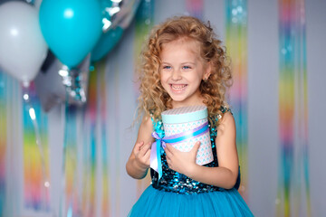 Fototapeta na wymiar happy Birthday! happy child girl in elegant dress