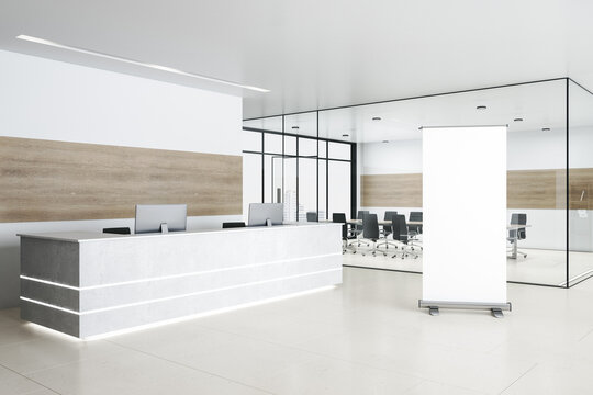Luxury conference room with reception desk and blank vertical banner.