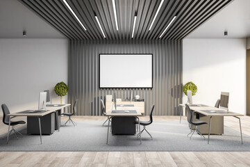 Stylish workplace with blank banner on wooden wall.