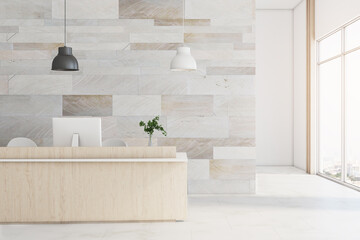 Comfortable office hall with wooden reception desk and computers.