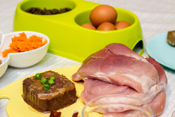 Preparing natural organic food for pets at home. Raw ingredients for pet food in bowl