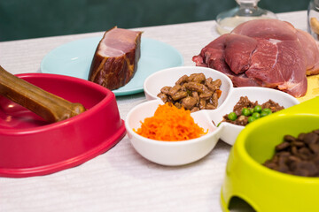 Preparing natural organic food for pets at home. Raw ingredients for pet food in bowl