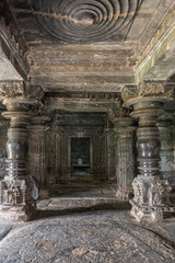 Lakkundi, Karnataka, India - November 6, 2013: Kasivisvesvara Temple. portrait shot, Looking through manadapam hall to inner sanctum with Shivalingam.