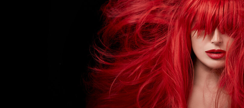 Sensual sexy beauty portrait of a red haired young woman with a healthy shiny long hair