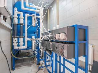 Automated computerized ozone generator machine for ozonation of pure clean drinking water in water production factory.