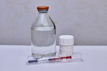 Syringe, bottle and pills. Preventive vaccination of people. Treatment of disease.