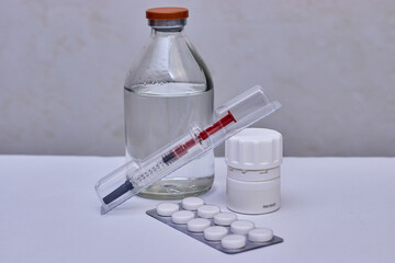 Syringe, pills and bottle. The vaccination of people. Preventive vaccination.