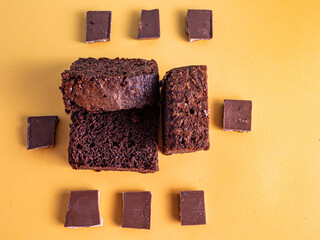 Photograph of pieces of brownie with chocolate around