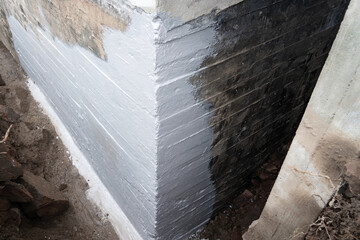 Waterproofing foundation of an old house.