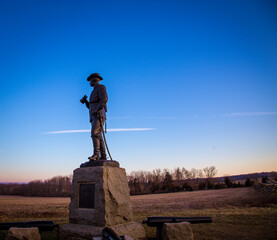 solider statue at sunrise in Gettysburg