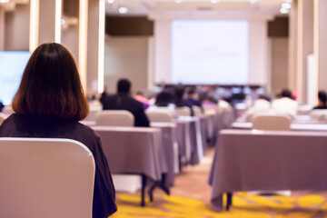 Blurry of auditorium for shareholders' meeting or seminar event with projector, Annual shareholder...