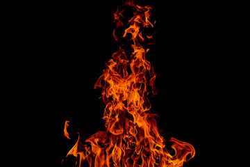 Bright orange red fire flame against black background, abstract texture, copyspace
