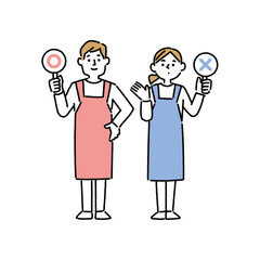 正解と不正解のプラカードを持つエプロン姿の男女