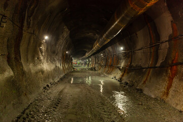 Fototapeta na wymiar Metro construction in the city. Blasting work in the subway. Descent into the ground.
