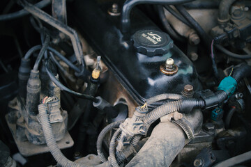 Dirty car engine. Close-up. Top view. Selective focus. Background. Texture.