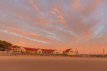 Beautiful winter's sunrise over Nobbys  Surf Club and Pavilion. Nobbys  Beach , Newcastle, Hunter...