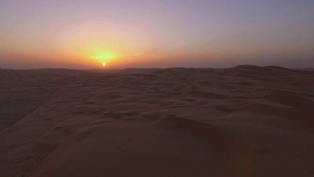 Liwa Oasis Abu Dhabi sandy middle east arid sunset desert extreme terrain aerial fly over