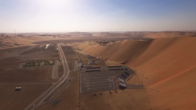 Liwa Oasis Nomad city in empty quarter sandy desert landmark Abu Dhabi aerial view fly over