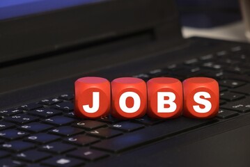 dice with letters JOBS on a keyboard - job search & online application