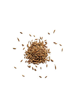 Top view of a pile of organic dry cumin seeds isolated on a white background
