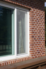 Windows of red brick house.