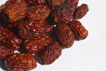 close up Red dates on white background.