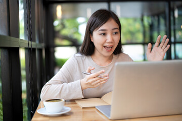 Unrecognizable cheerful young businesswoman reading a message on a smartphone close up.