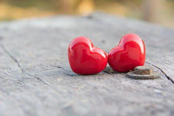 Fototapeta premium valentine concept.Red hearts on wooden with soft light.