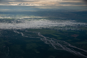 Aerial view of a river with a crop field around it at dusk. Colombia.