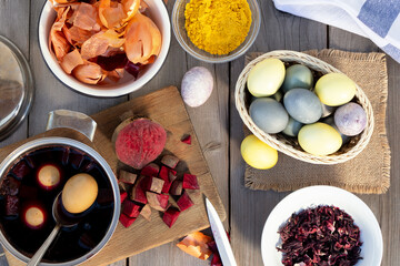Process of coloring Easter eggs with various food natural dyes. Preparing for Easter.