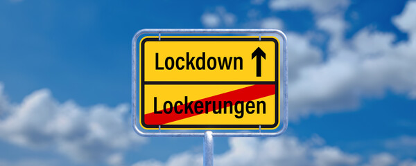 street sign showing the German message for leaving EASING and entering LOCKDOWN in front of a...