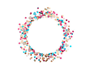 A round frame made of multicolored shiny metallized confetti and shiny hearts is on a white background. Minimalistic layout for valentine's day. Flat lay. Top view. Copy space.