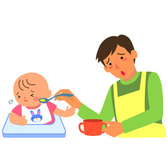 離乳食を嫌がる女の赤ちゃんと父親
