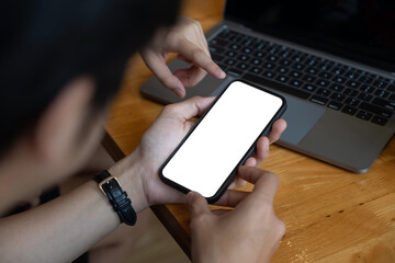 Man holding and touch smartphone blank screen in the mall. Take your screen to put on advertising