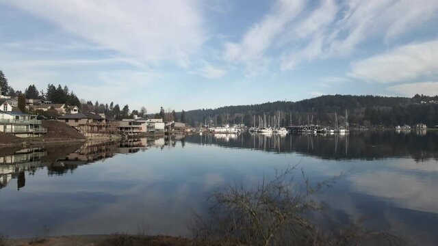 Postcard picture reflection of the landscape surrounding Gig Harbor Washington, aerial lift, and dolly