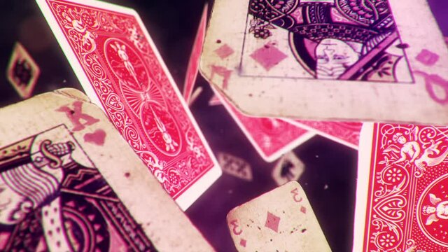 Animation of a worn out deck of French-suited playing cards floating and spinning randomly on a space background. Dreamy bokeh effect.