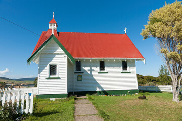 Fototapeta na wymiar Old traditional design St Mary's Anglican Church in Waikawa with red roof and white exterior.