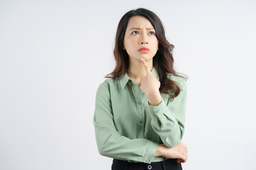 Portrait of a beautiful Asian businesswoman with a thinking look