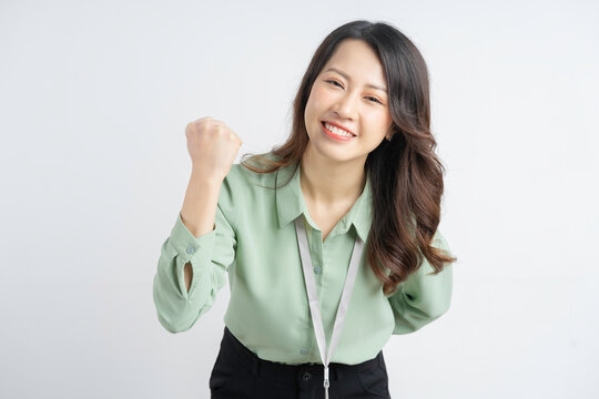 Portrait of a beautiful Asian businesswoman showing a successful expression