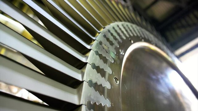Tigh shot of large expander blades from a power recover train on large oil refinery in UK. 

Showing blade design and root fixing points.